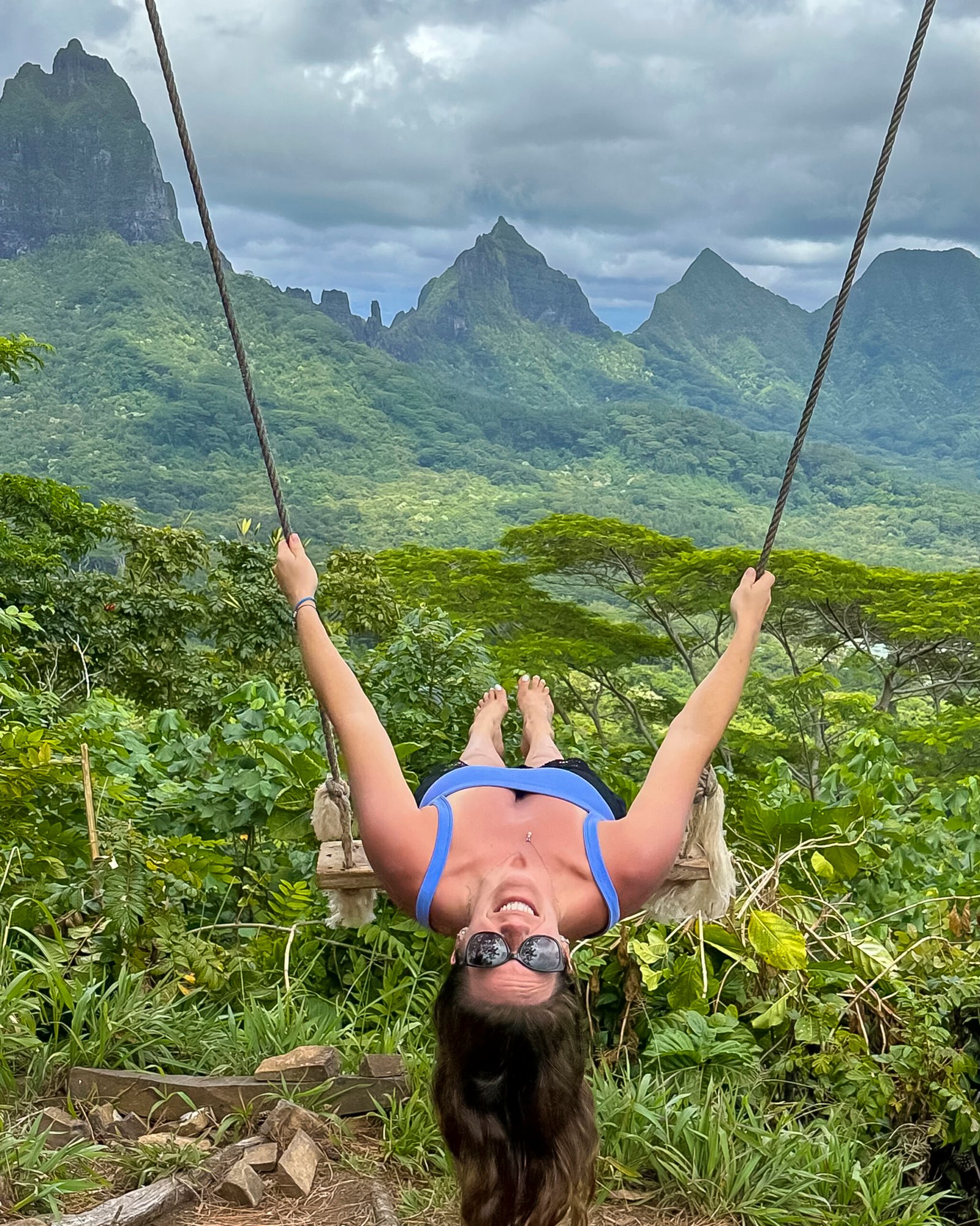 girl on swing in the mountain Moorea French Polynesia