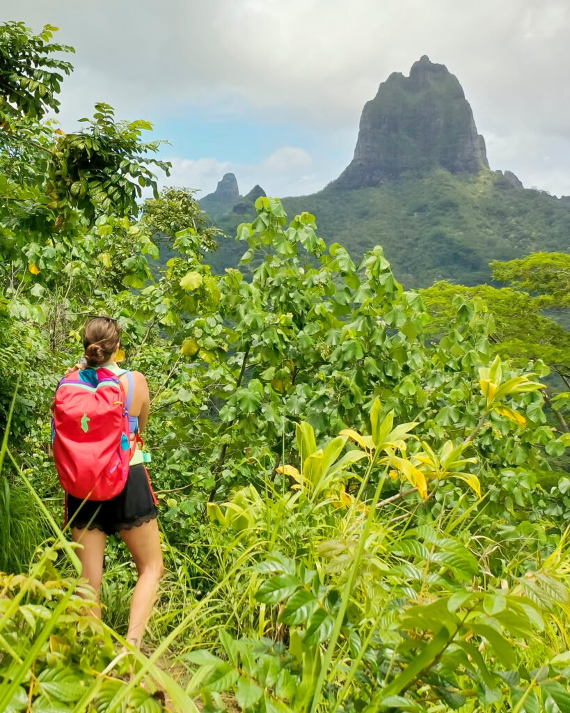girl on the mountain in moorea with Cotopaxi backpack