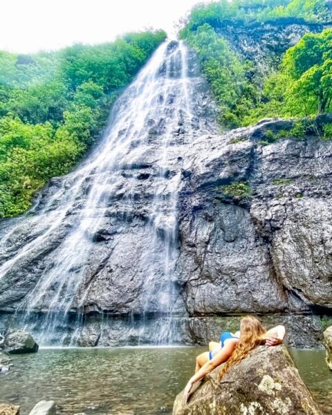 Ashley at a waterfall in moorea
