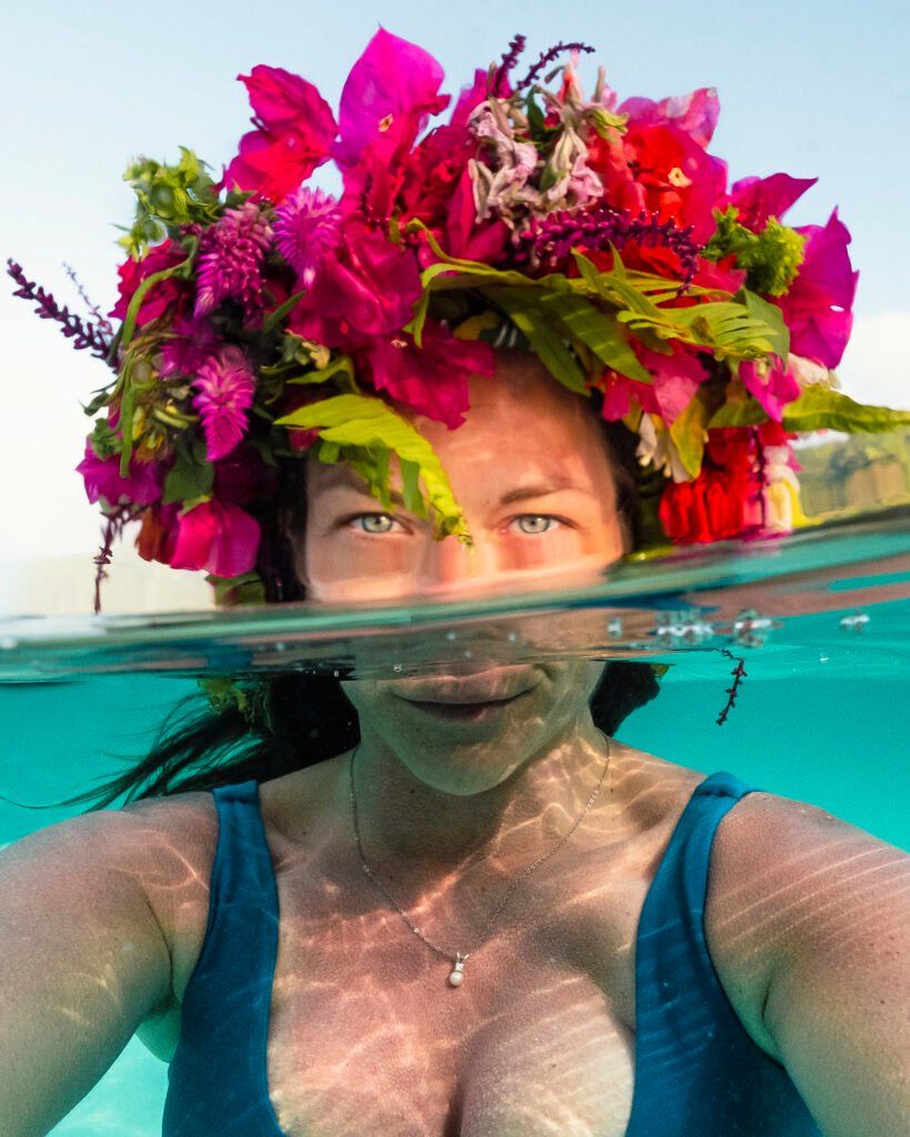 Ashley in a flower crown half half shot ocean and sky